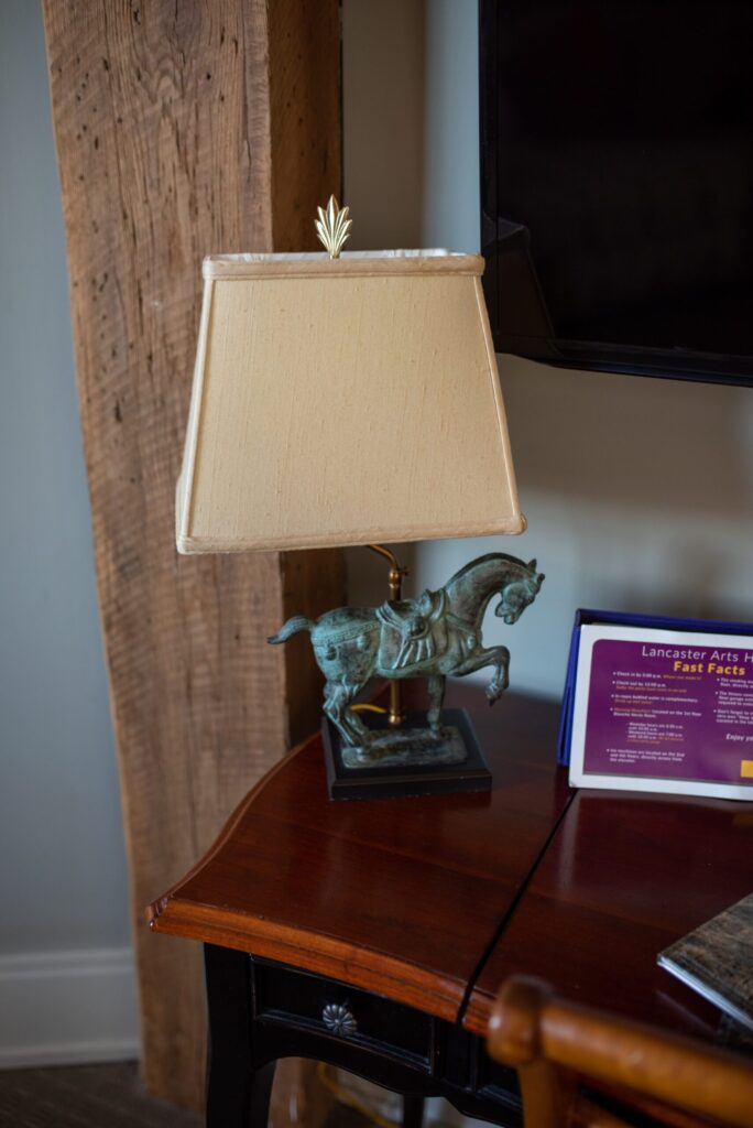 a desk with a lamp and a plaque on it