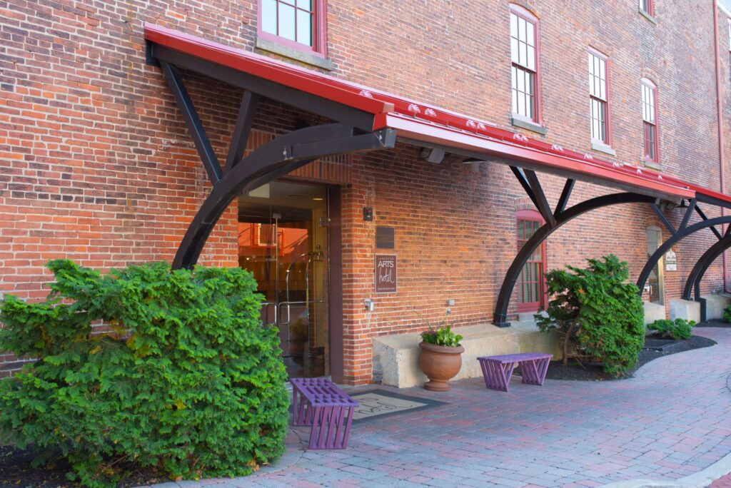 a brick building with an awning over the entrance