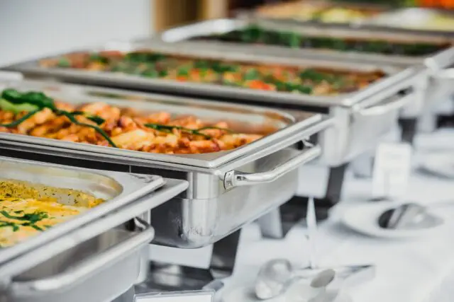 a buffet line with many different types of food