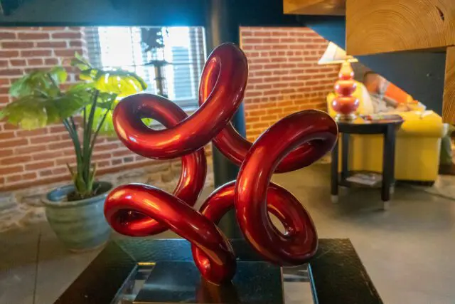 a red sculpture sitting on top of a table